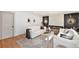 Modern living room featuring a fireplace, neutral furniture, and stylish decor at 5872 Taft St, Arvada, CO 80004