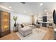 Living room boasts a sectional sofa, decorative lighting, and a dedicated workspace at 5872 Taft St, Arvada, CO 80004