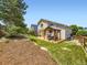 Beautiful backyard with a patio, pergola, seating area, and well-maintained lawn at 5130 Morning Glory Pl, Highlands Ranch, CO 80130
