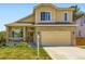 Charming two-story home with a well-manicured lawn and attached two-car garage at 5130 Morning Glory Pl, Highlands Ranch, CO 80130