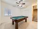 Recreation room with a pool table, ample space, and natural light at 5130 Morning Glory Pl, Highlands Ranch, CO 80130