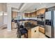 Gourmet kitchen with stainless appliances, granite counters, and custom cabinetry at 5130 Morning Glory Pl, Highlands Ranch, CO 80130