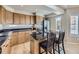 Bright kitchen boasting granite countertops, stainless steel appliances, and a central island at 5130 Morning Glory Pl, Highlands Ranch, CO 80130