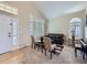 Bright living room features neutral decor, plantation shutters, and ample natural light at 5130 Morning Glory Pl, Highlands Ranch, CO 80130