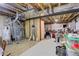 Unfinished basement space with exposed ceiling, providing potential for customization at 6328 S Ouray Way, Aurora, CO 80016