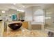 Bright bathroom featuring dual vessel sinks, soaking tub, and walk-in shower at 6328 S Ouray Way, Aurora, CO 80016