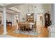 Formal dining room featuring hardwood floors, classic furnishings, and elegant lighting at 6328 S Ouray Way, Aurora, CO 80016