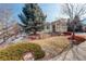 Beautifully landscaped front yard with a large tree at 6328 S Ouray Way, Aurora, CO 80016