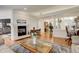 Inviting living room showcasing a fireplace and an open-concept design at 6328 S Ouray Way, Aurora, CO 80016