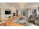 Spacious living room boasting a fireplace and an abundance of natural light at 6328 S Ouray Way, Aurora, CO 80016