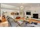 Bright living room showcasing the open floor plan, fireplace, and hardwood floors at 6328 S Ouray Way, Aurora, CO 80016