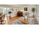 Elegant living room with hardwood floors and a separate seating area at 6328 S Ouray Way, Aurora, CO 80016