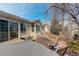 Brick patio shows multiple seating options, sliding glass doors, and a lush backyard at 6328 S Ouray Way, Aurora, CO 80016