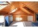 Cozy attic space with wooden ceilings, skylights, and modern blue dresser at 3521 W 40Th Ave, Denver, CO 80211