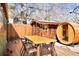 Inviting backyard featuring a barrel sauna, a custom shed, and wooden table for outdoor relaxation and entertainment at 3521 W 40Th Ave, Denver, CO 80211