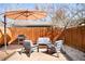 Cozy backyard patio featuring outdoor seating, umbrella, and barbeque grill at 3521 W 40Th Ave, Denver, CO 80211
