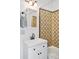 Bathroom with a vanity, medicine cabinet, and a shower featuring decorative tiles at 3521 W 40Th Ave, Denver, CO 80211
