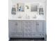 Bathroom featuring double vanity with gray cabinets, mirrors, and tile accent wall at 3521 W 40Th Ave, Denver, CO 80211