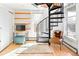 Unique space with a spiral staircase, hardwood floors, and a sunny window at 3521 W 40Th Ave, Denver, CO 80211