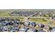 Wide aerial view of a neighborhood and a collection of Gathering homes at 118 N Newcastle Way, Aurora, CO 80018