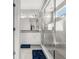 Bright bathroom features white cabinetry, granite countertops, and a spacious glass-enclosed shower at 118 N Newcastle Way, Aurora, CO 80018