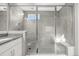 Sleek bathroom with a glass-enclosed shower, rainfall showerhead, and tiled walls for a luxurious bathing experience at 118 N Newcastle Way, Aurora, CO 80018