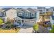 Two-story home with stone accents, covered porch, and two-car garage in a desirable neighborhood at 118 N Newcastle Way, Aurora, CO 80018