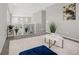 Upstairs hallway with plush carpeting, white railing, and stylish decor, offering a bright and open transition space at 118 N Newcastle Way, Aurora, CO 80018
