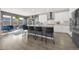 Modern kitchen with a large island, stainless steel appliances, and ample counter space at 118 N Newcastle Way, Aurora, CO 80018