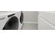 Modern laundry room with high-efficiency washer and dryer at 118 N Newcastle Way, Aurora, CO 80018