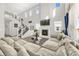 Spacious living room with a fireplace, large windows, a soaring ceiling, and hardwood flooring at 118 N Newcastle Way, Aurora, CO 80018
