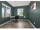 Dedicated home office space with natural light and neutral color palette for a productive work environment at 118 N Newcastle Way, Aurora, CO 80018