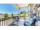 Covered back porch seating with unobstructed view of Colorado plains at 22674 E Henderson Dr, Aurora, CO 80016
