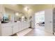 Spacious bathroom with double vanity, and an open doorway to the Main Bedroom at 22674 E Henderson Dr, Aurora, CO 80016
