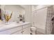 Bathroom boasts a white marble countertop, white cabinets, and a shower and tub combo at 22674 E Henderson Dr, Aurora, CO 80016