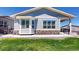 Beautiful home featuring stone accents, well-kept lawn, and classic shutters on its many windows at 22674 E Henderson Dr, Aurora, CO 80016