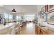 Bright, open-concept living space with hardwood floors and seamless flow to the kitchen at 22674 E Henderson Dr, Aurora, CO 80016