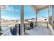 Cozy covered porch featuring a classic white rocking chair and neighborhood views at 22674 E Henderson Dr, Aurora, CO 80016