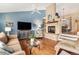 Bright living room with hardwood floors, fireplace, and vaulted ceiling at 325 Lodgewood Ln, Lafayette, CO 80026