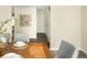 Dining room features hardwood table, chairs, and art at 2434 S Williams St, Denver, CO 80210
