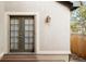 Exterior detail with an exterior lantern, a door with window panes and a small porch at 2434 S Williams St, Denver, CO 80210