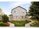Attractive two-story home with symmetrical facade, complemented by lush green lawn at 2434 S Williams St, Denver, CO 80210