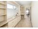 Home office with built-in shelving, drawers, and a bright window at 2434 S Williams St, Denver, CO 80210