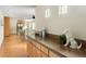 Open-concept living space features hardwood flooring, built-in cabinetry, and access to the kitchen at 2434 S Williams St, Denver, CO 80210
