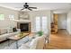 Cozy living room featuring a fireplace, hardwood floors, and natural light at 2434 S Williams St, Denver, CO 80210