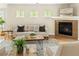 Inviting living room with warm fireplace, comfortable seating, and ample natural light at 2434 S Williams St, Denver, CO 80210