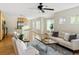 Bright living space blending living and kitchen areas with hardwood flooring and neutral palette at 2434 S Williams St, Denver, CO 80210