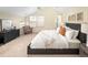 Bedroom features vaulted ceilings, a ceiling fan and large windows and a dark colored dresser at 2434 S Williams St, Denver, CO 80210