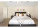Comfortable main bedroom with a large bed, side tables, and decorative wall art at 2434 S Williams St, Denver, CO 80210