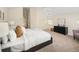 Spacious main bedroom featuring neutral tones, a large bed, and vaulted ceilings at 2434 S Williams St, Denver, CO 80210